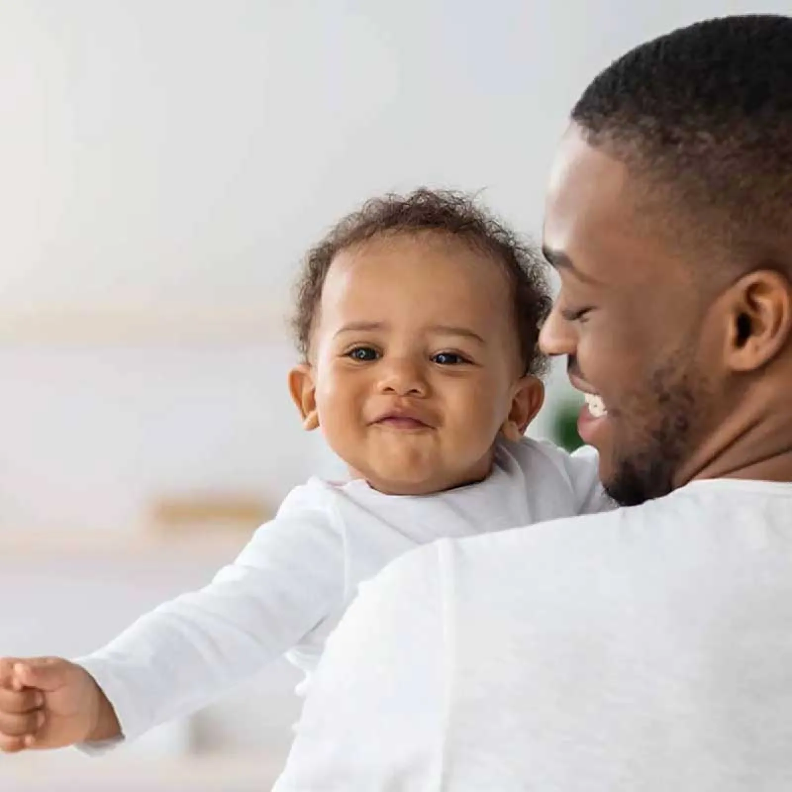 a man holding a baby