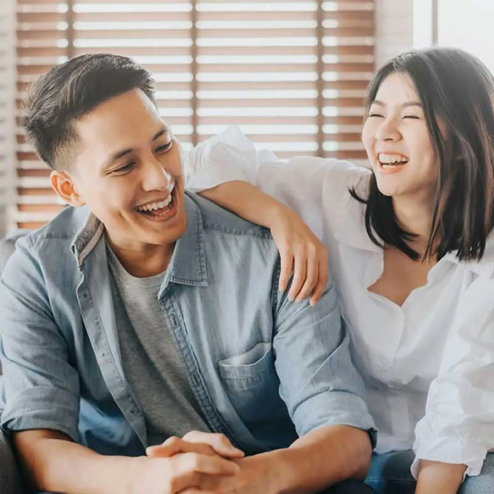 a man and a woman smiling