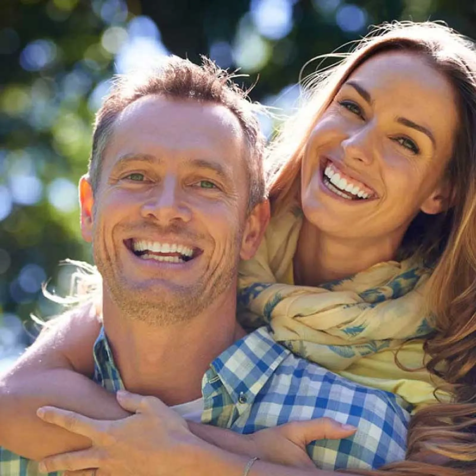 a man and woman smiling