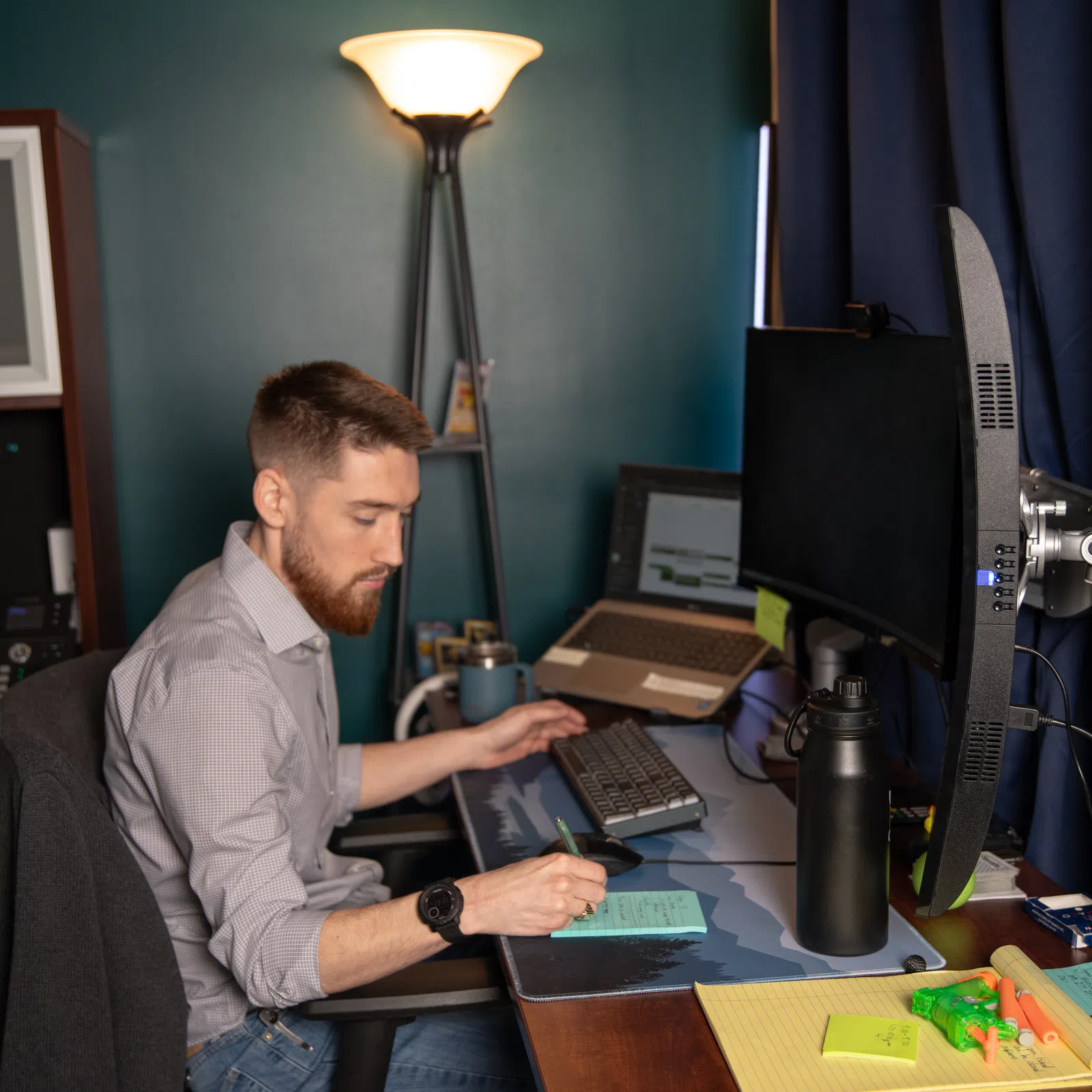 a man sitting at a table with a laptop