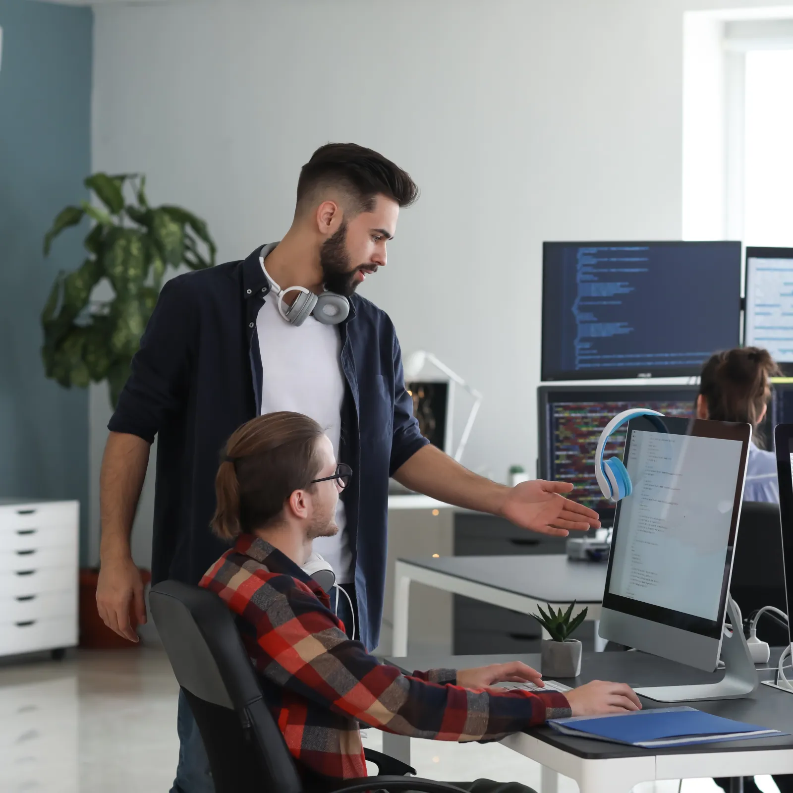 a man showing a woman something on the computer