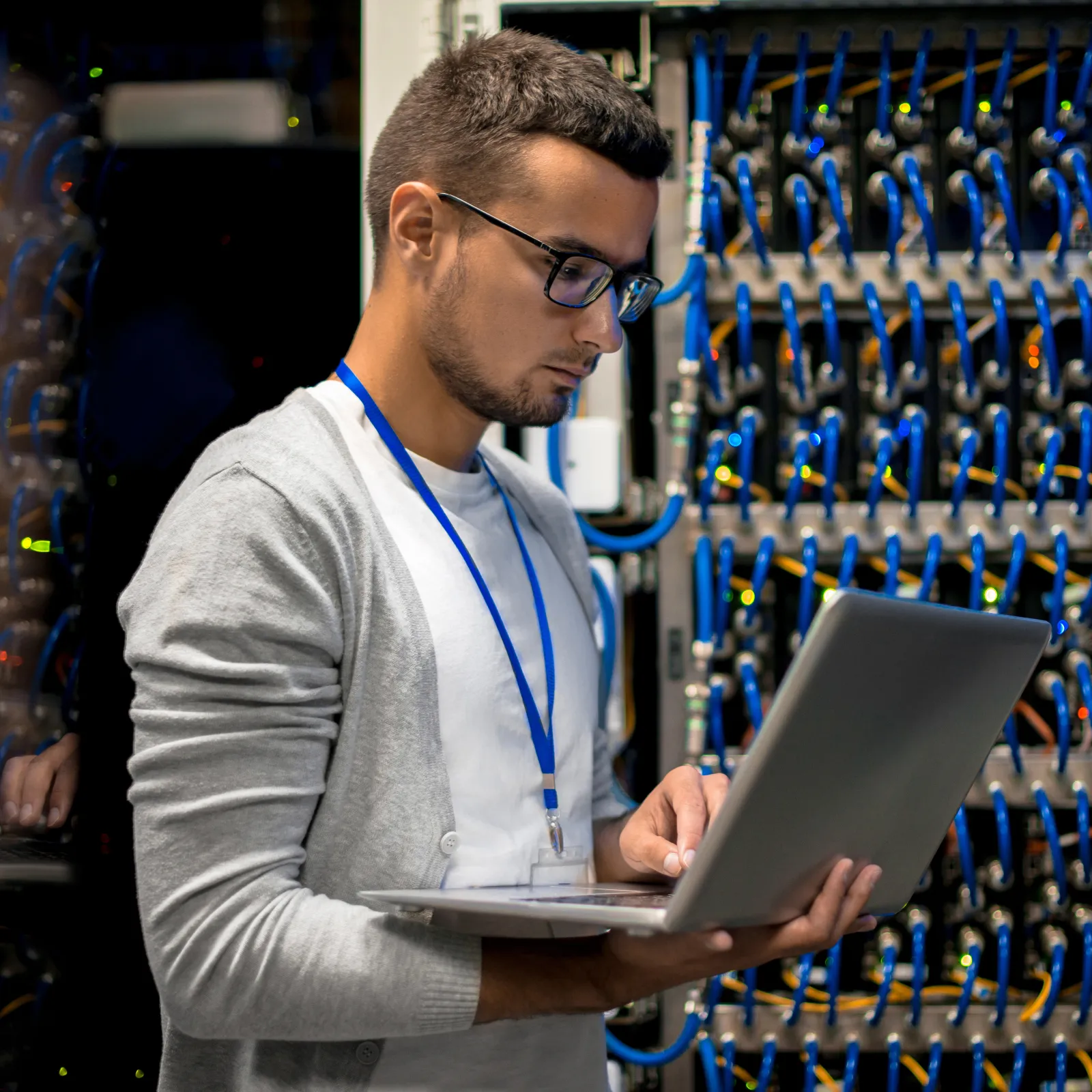 a man holding a laptop