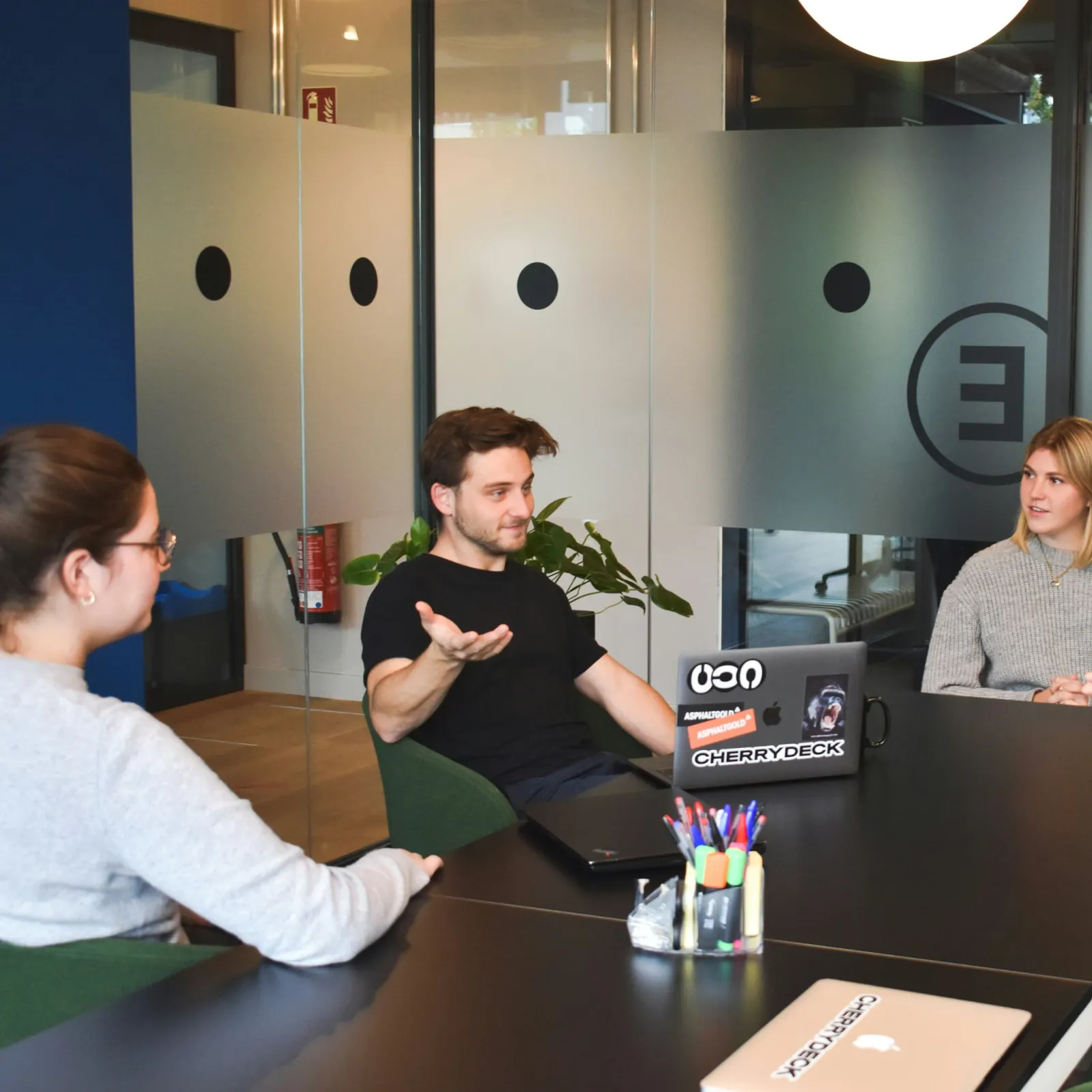 a group of people sitting around a table