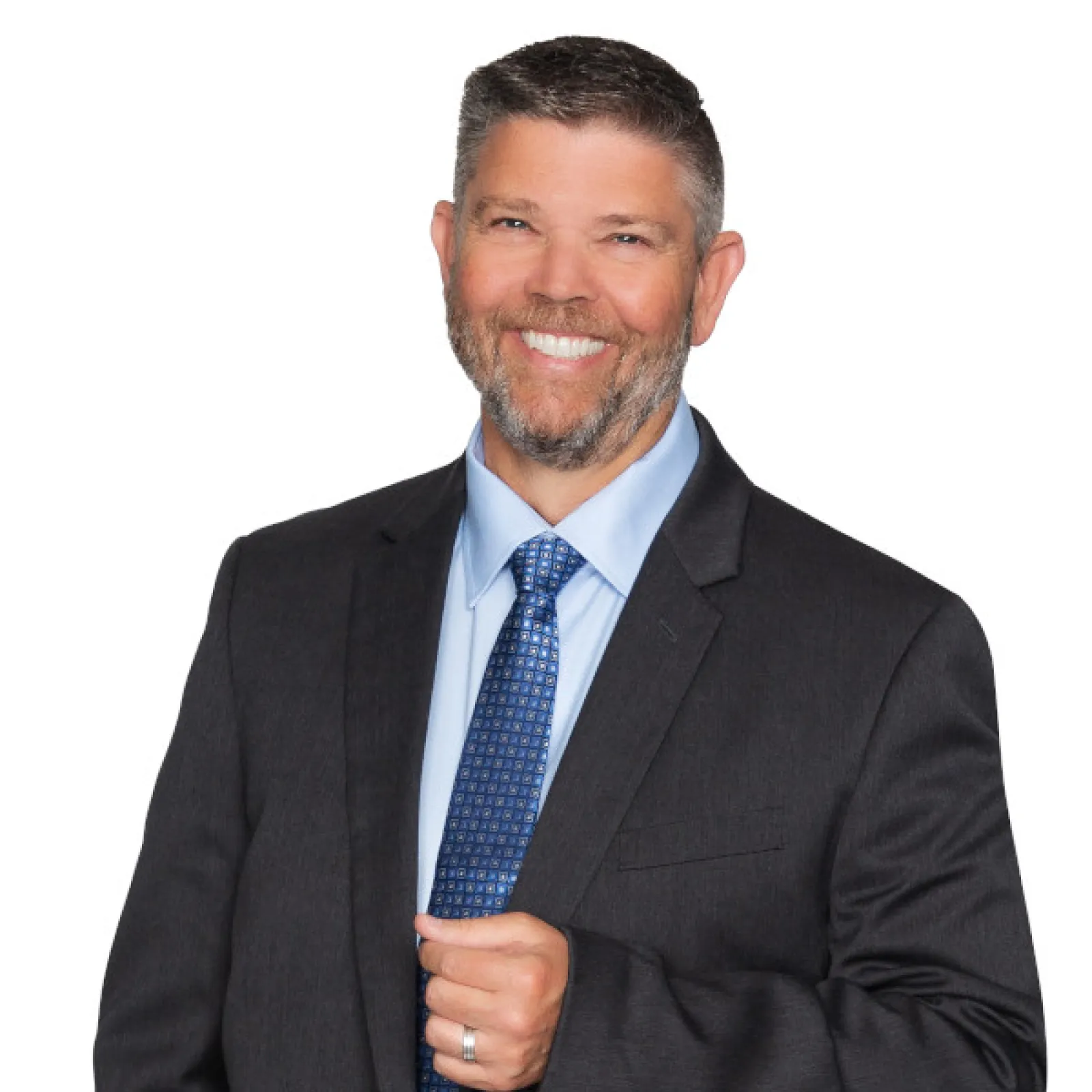 Professional man in a suit smiling confidently with a blue tie against a white background.
