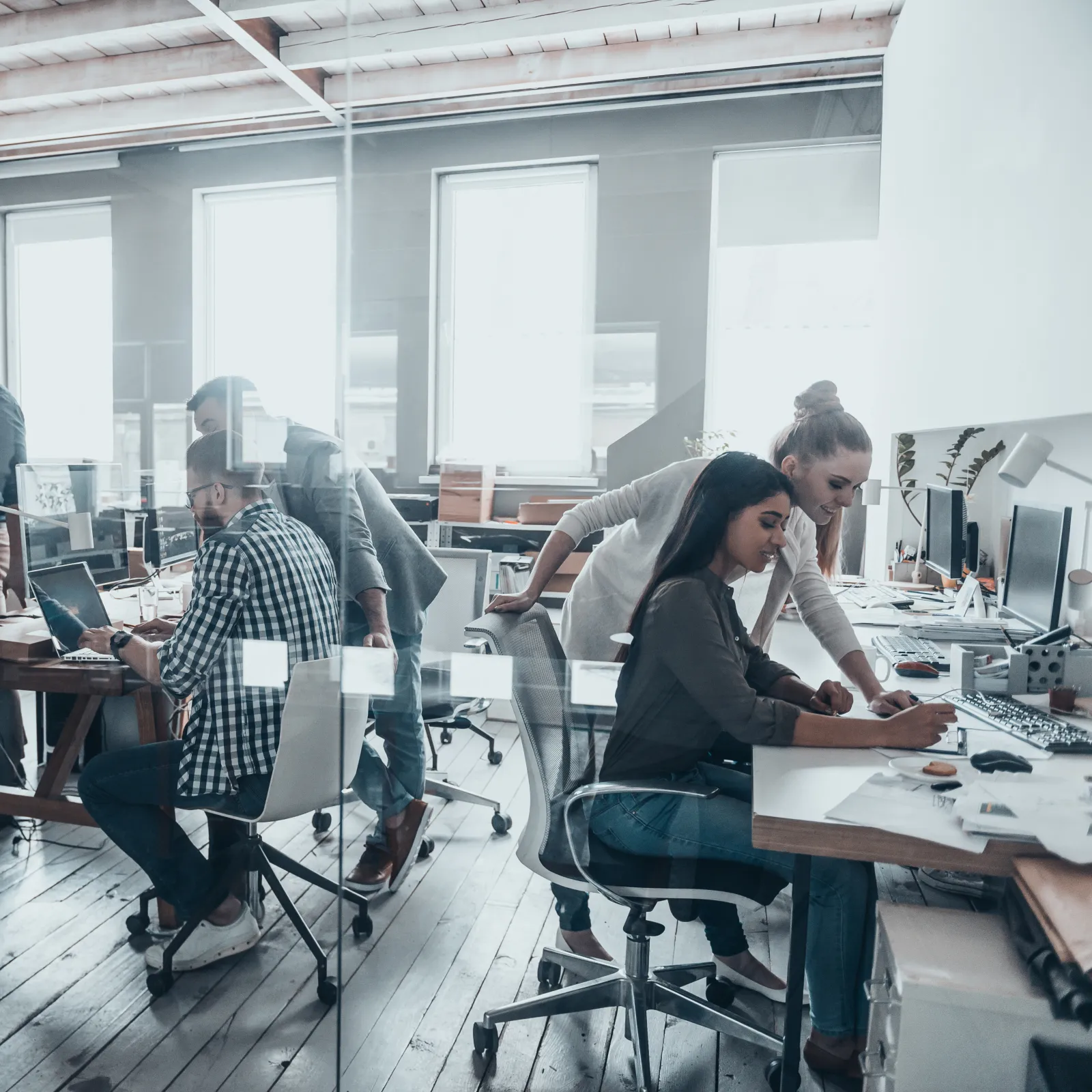 A vibrant co-working space with diverse professionals collaborating at desks and brainstorming ideas.