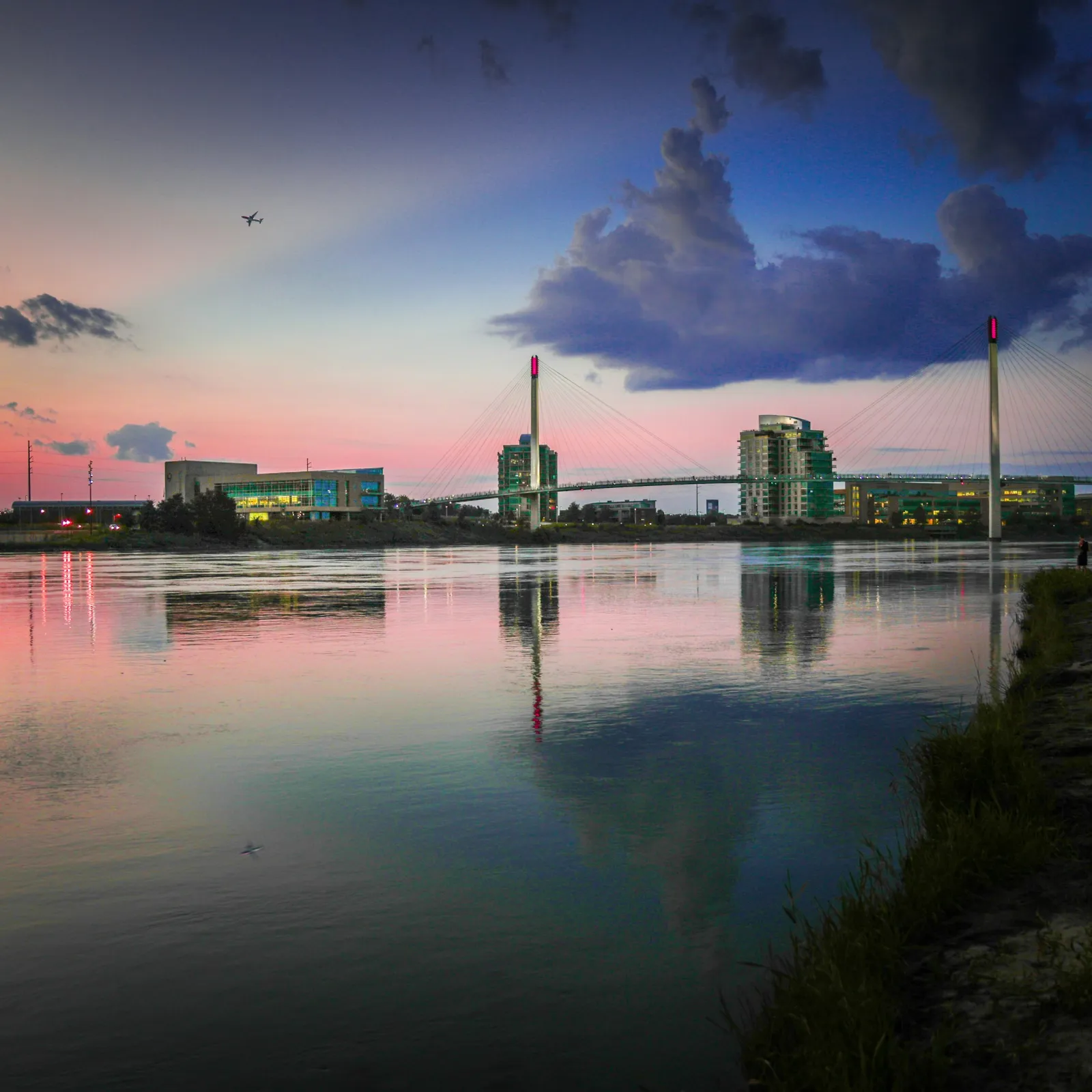 a body of water with buildings in the background