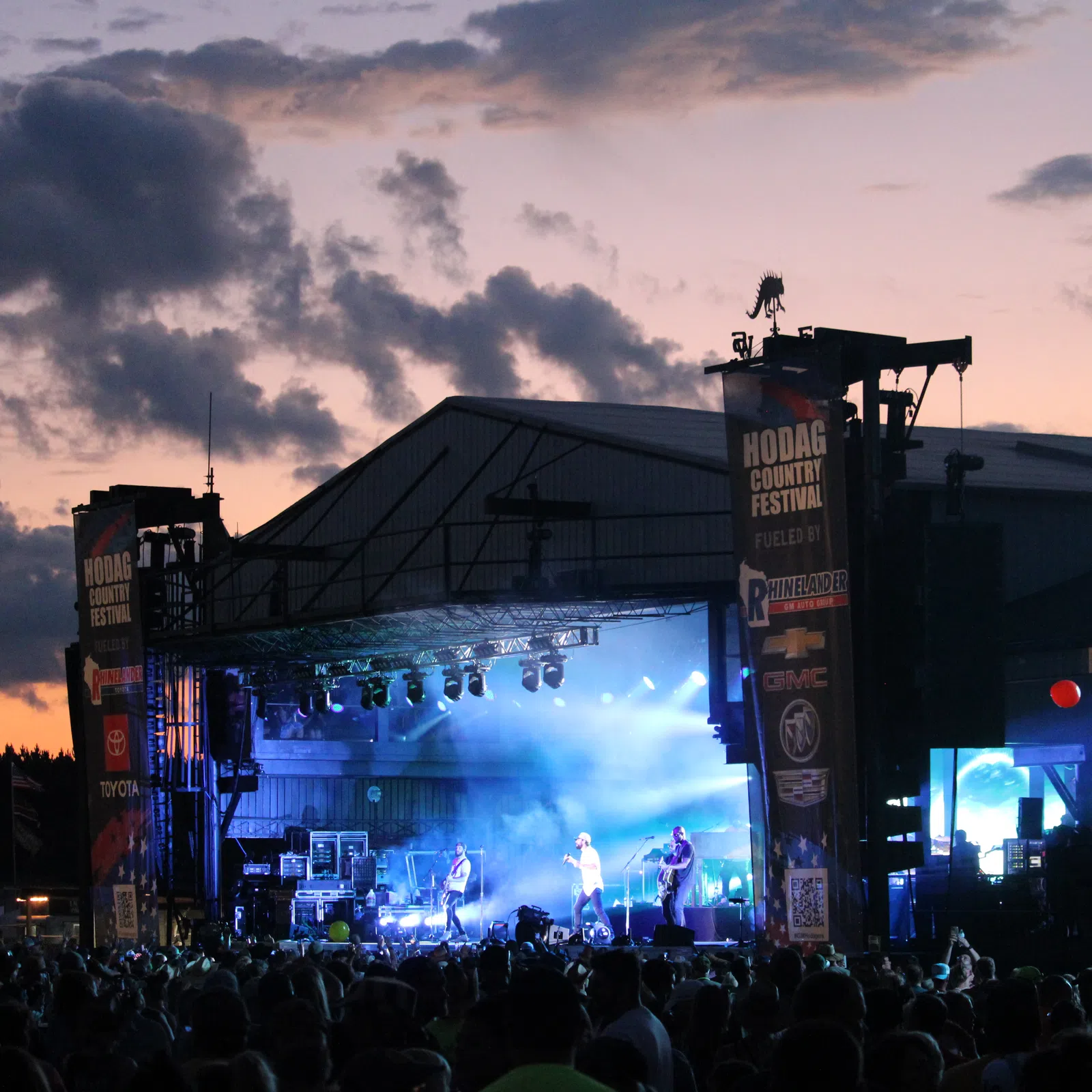a stage with a crowd of people in front of it