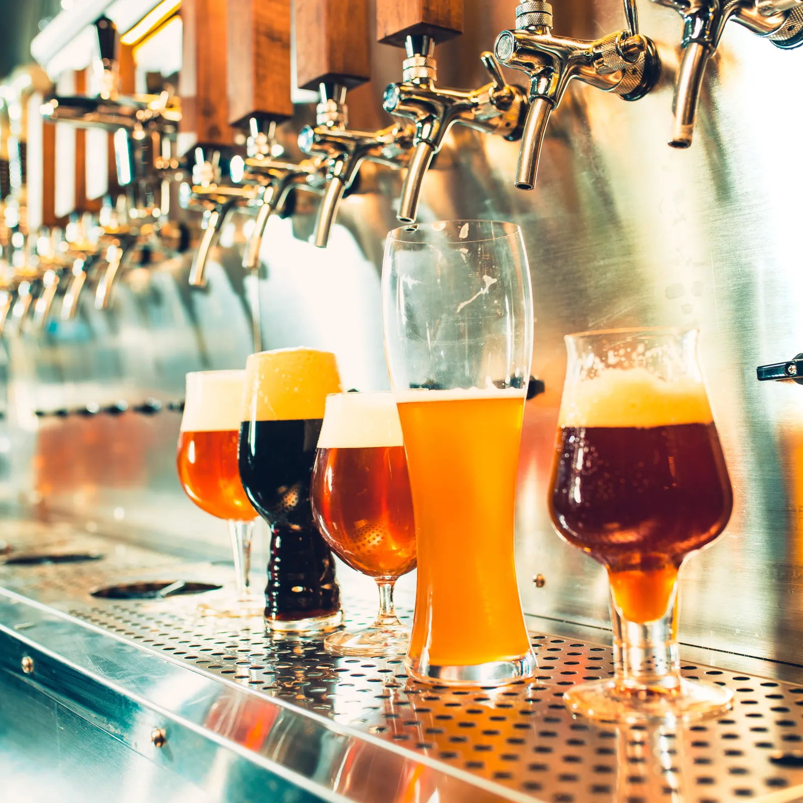 a row of glasses with liquid in them
