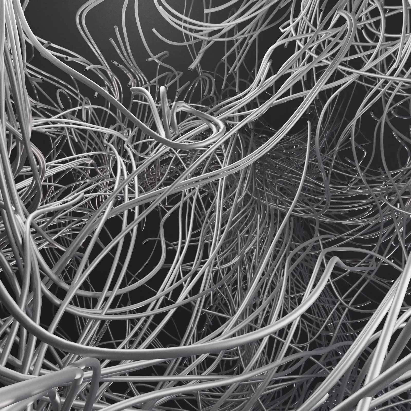Close-up of tangled silver wires creating a complex, abstract network against a dark background