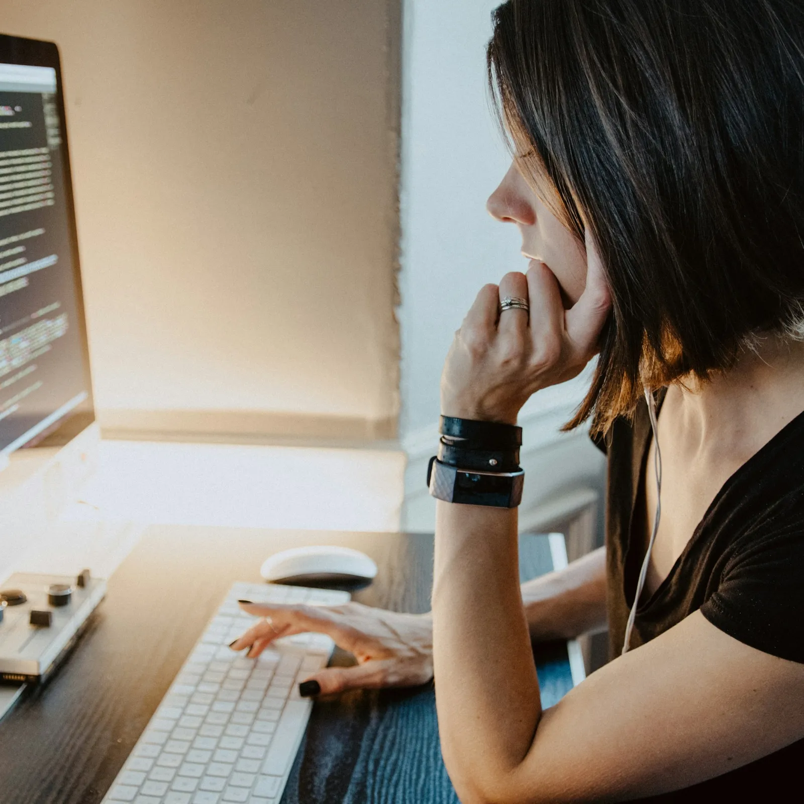a woman sitting at a computer