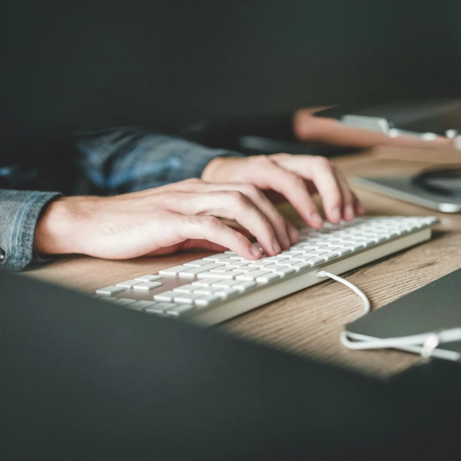 a person typing on a keyboard