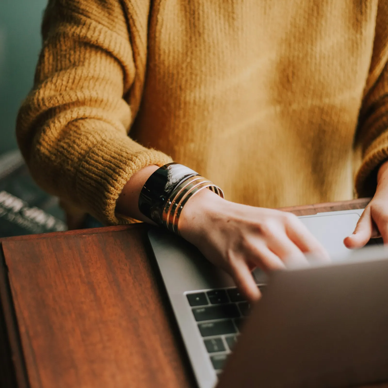 a person typing on a laptop