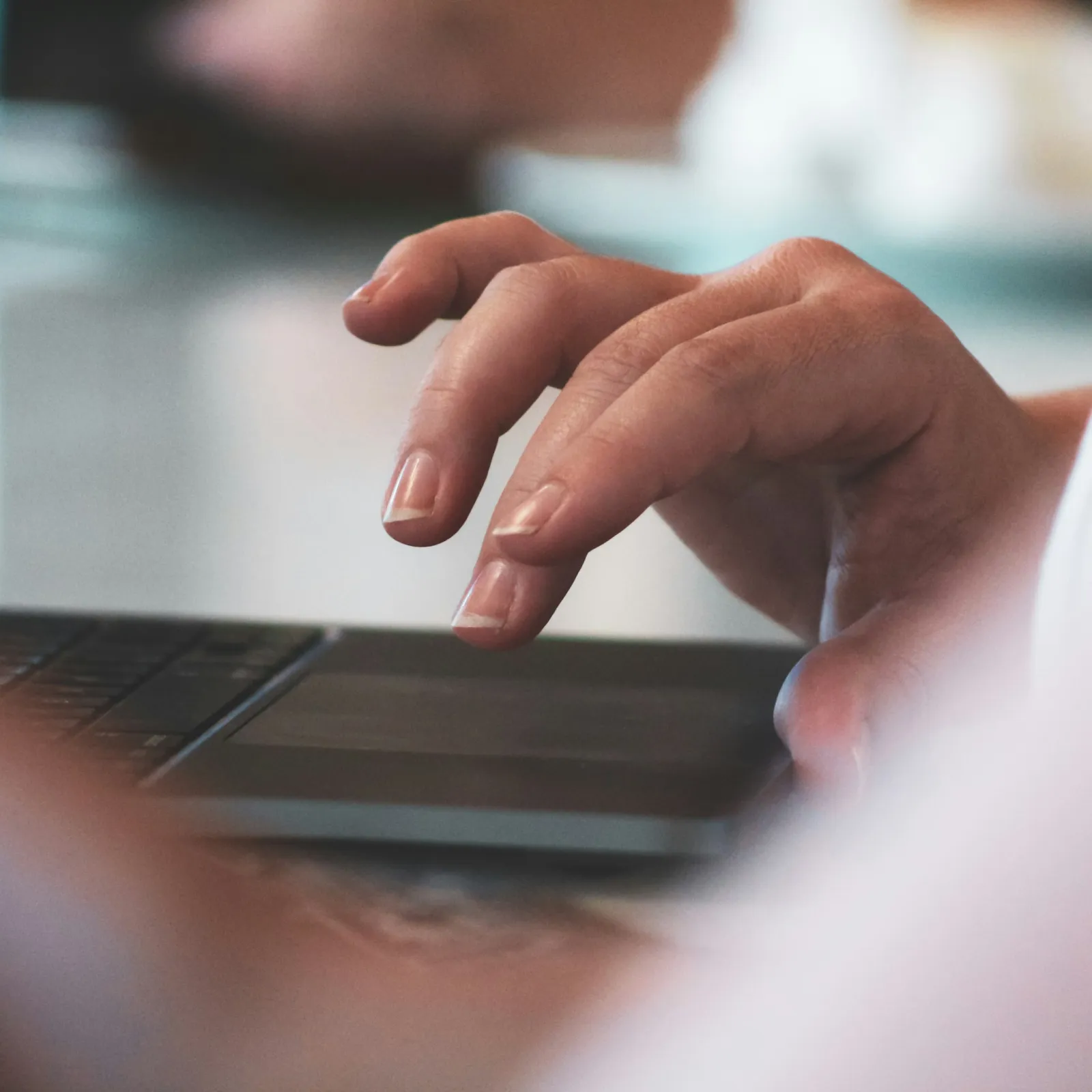 a close-up of a person using a laptop