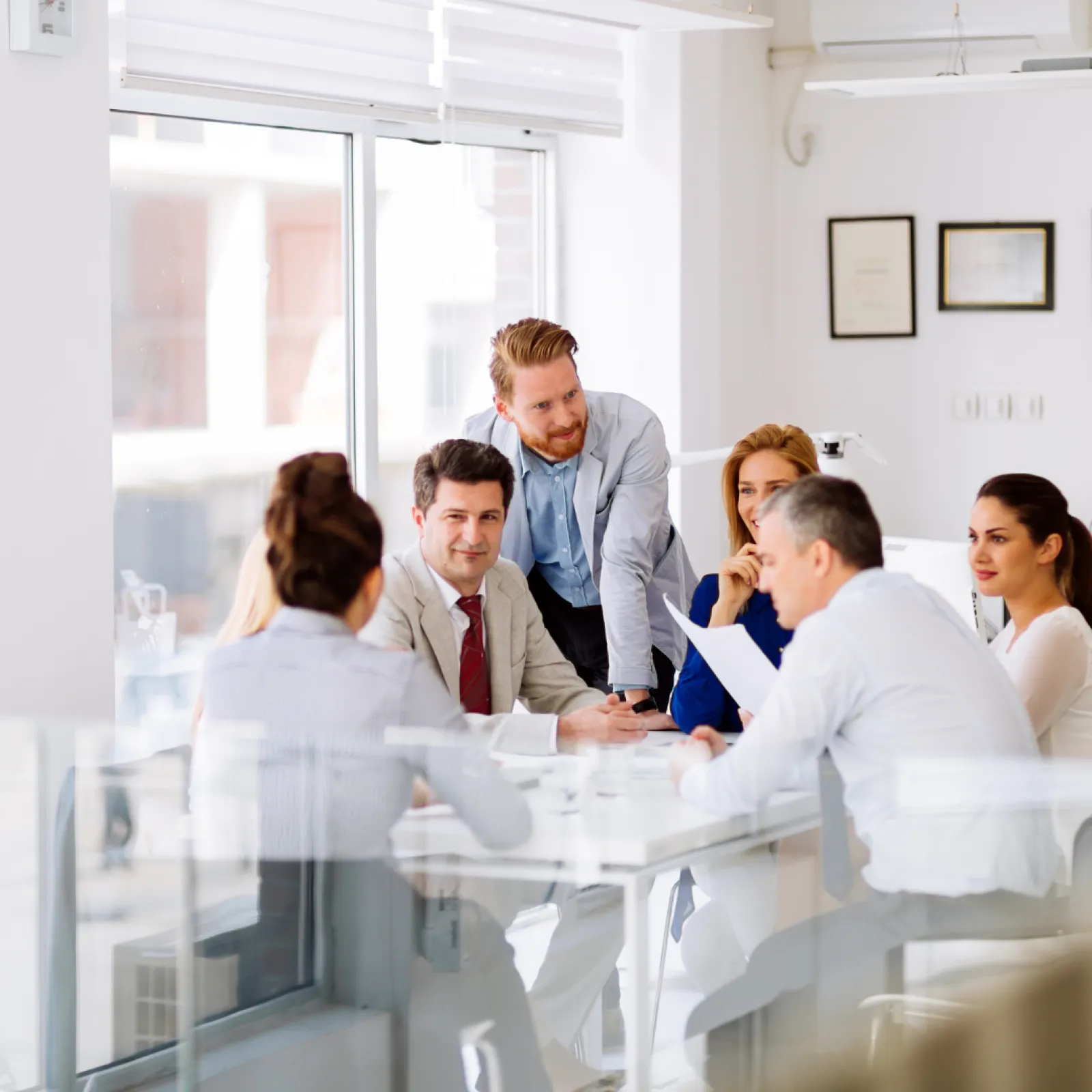 a group of people in a meeting