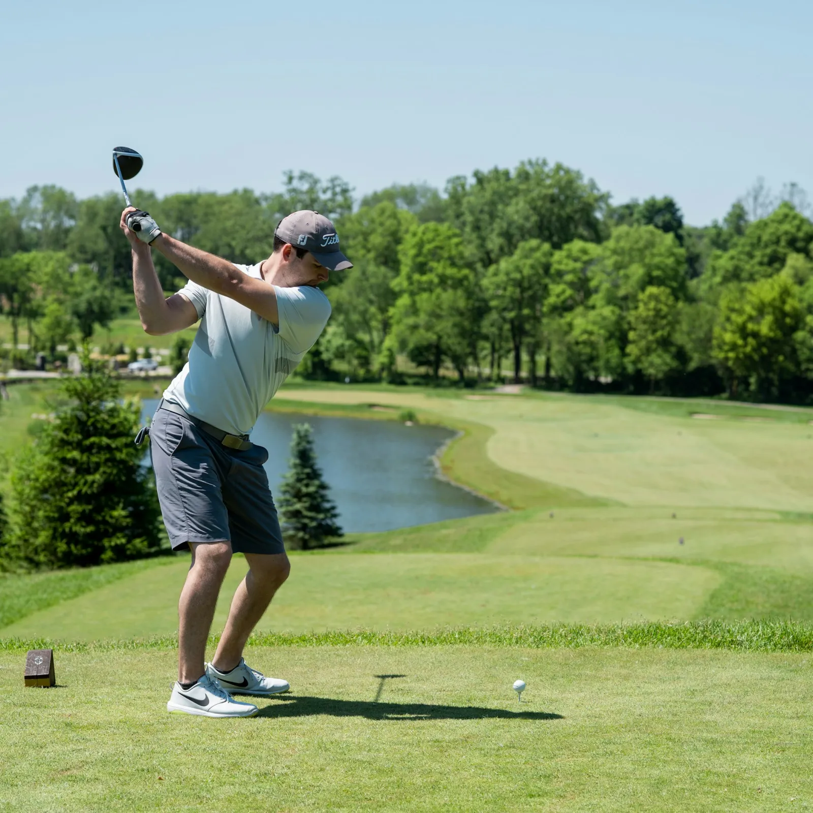 a man swinging a golf club