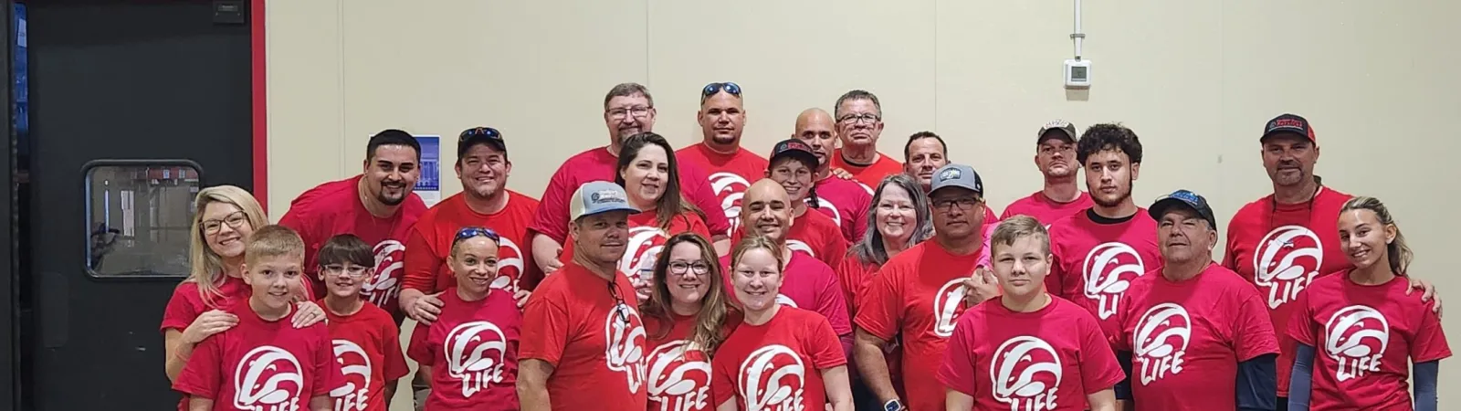 a group of people wearing matching t-shirts