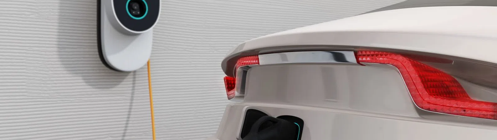 Electric car charging with a sleek wall-mounted charger in a modern setting.