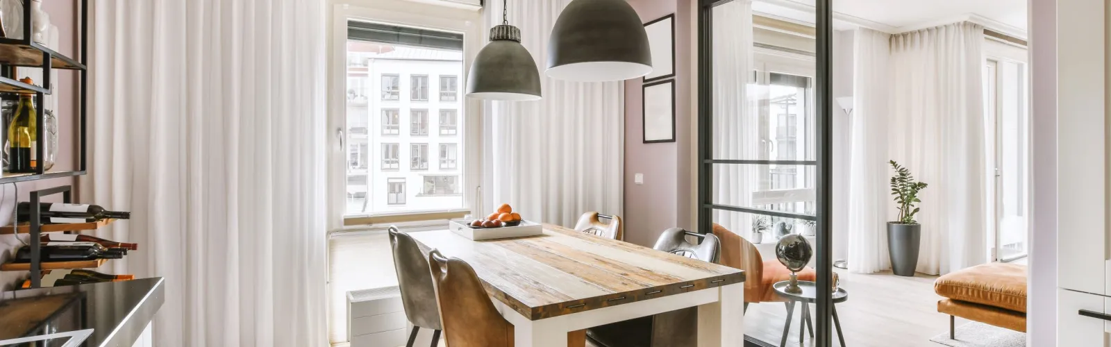 a dining room with a table and chairs