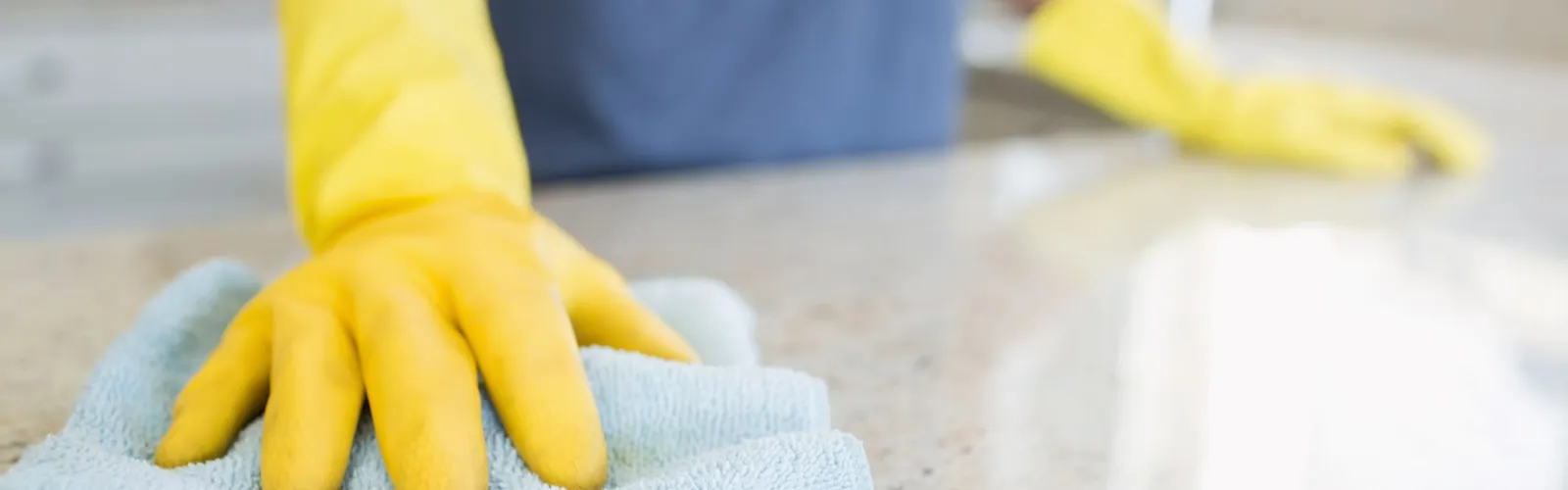 a person in a blue and orange garment on a white counter