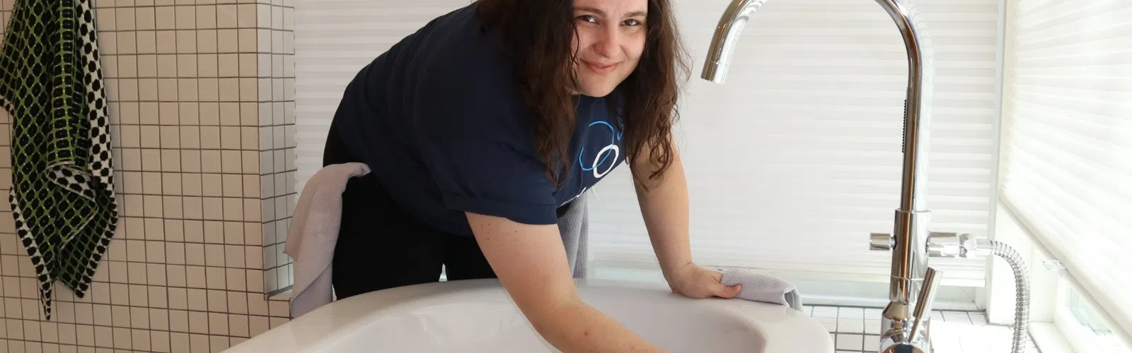 MaidPro Cypress house cleaning professional cleaning a bathtub in California
