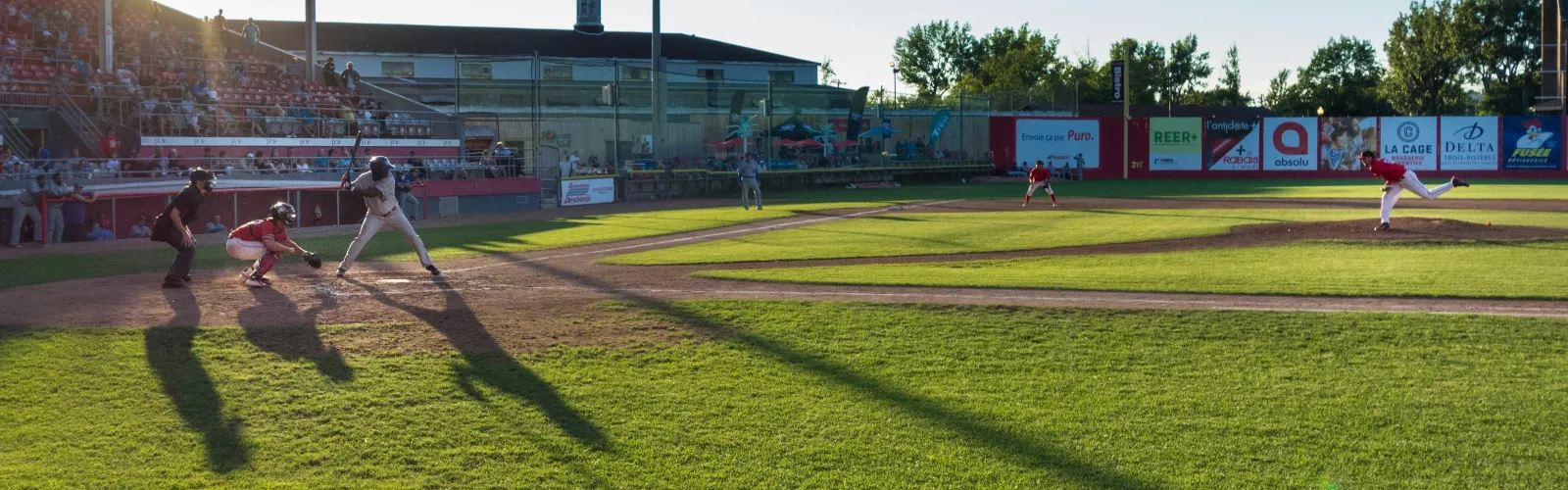 a group of people playing baseball