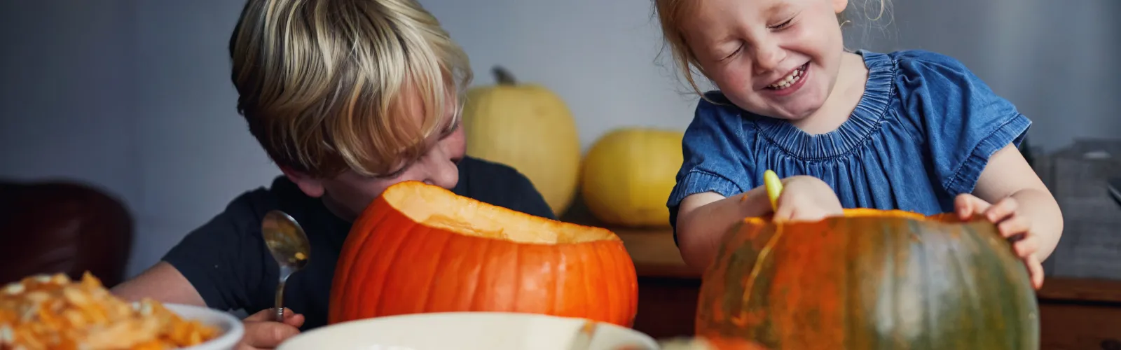 kids carving pumpkins