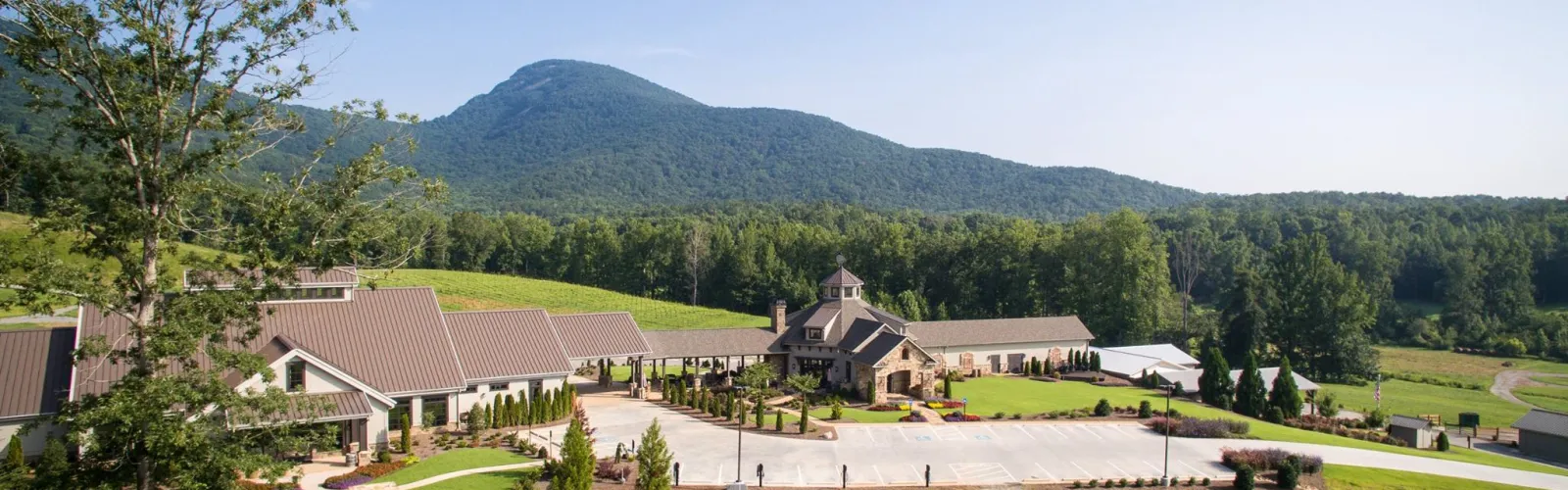 a house with a mountain in the background