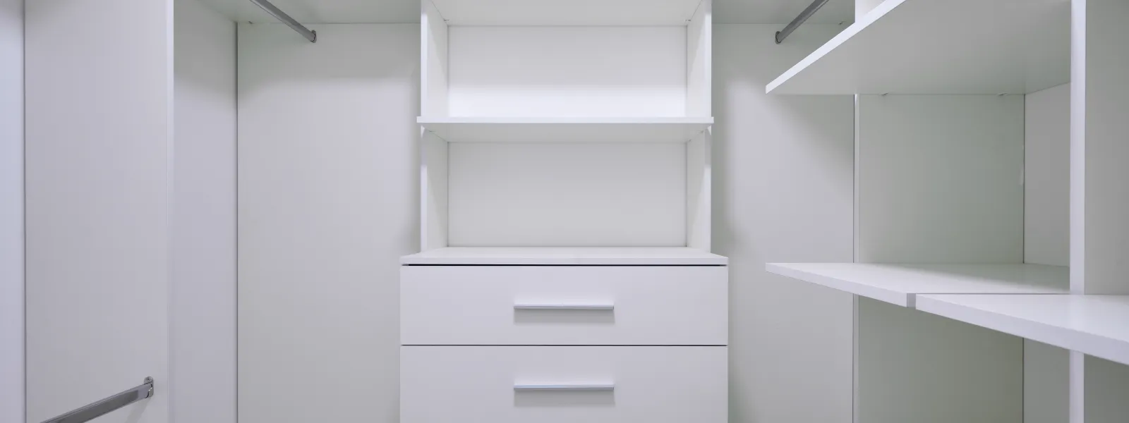 a white shelf with drawers