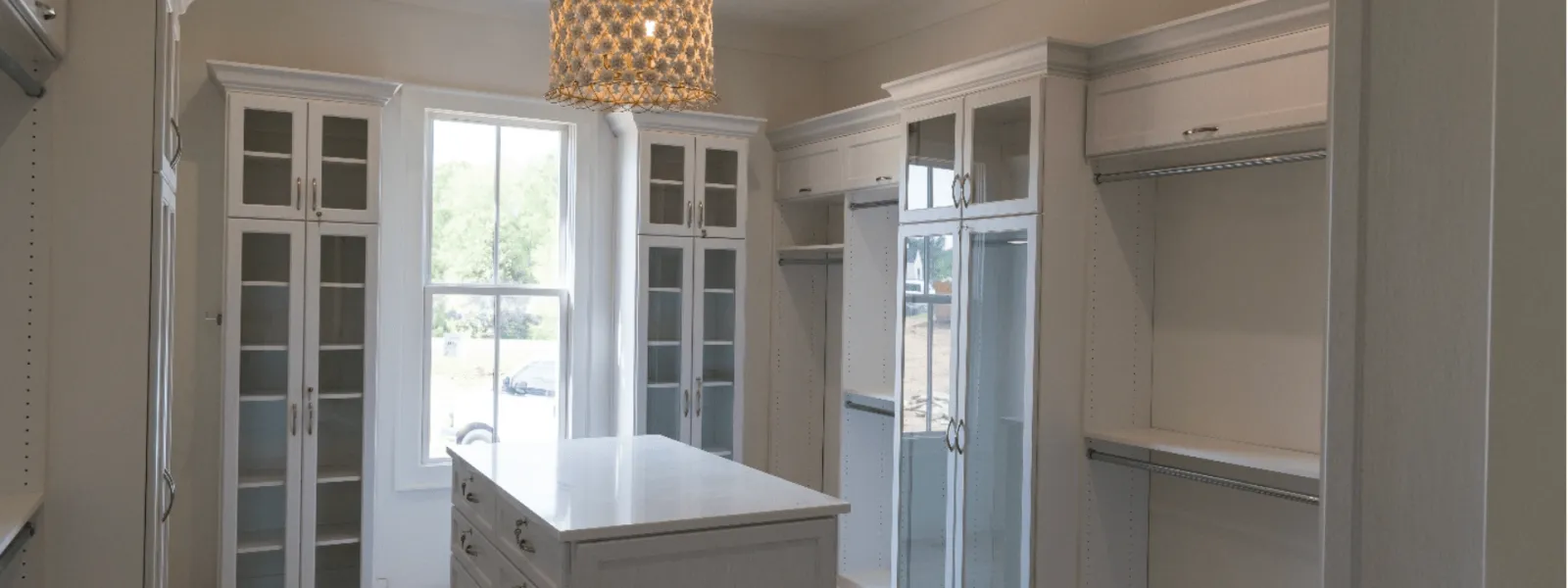 White cabinets and a chandelier