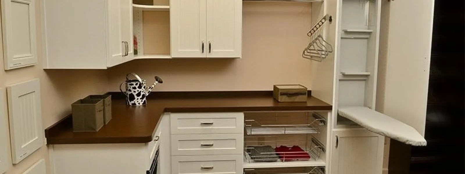 a laundry room with an ironing board