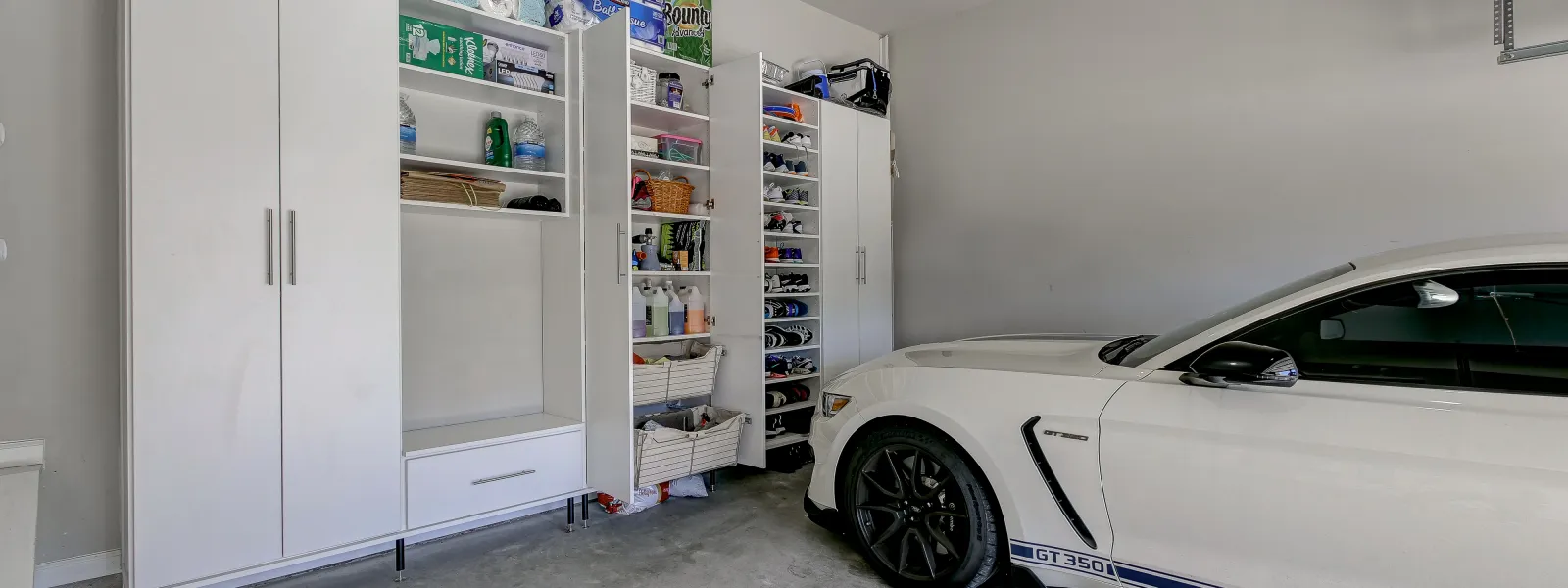 a white car parked in a room