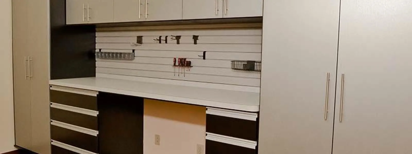 a garage with cabinets and shelves