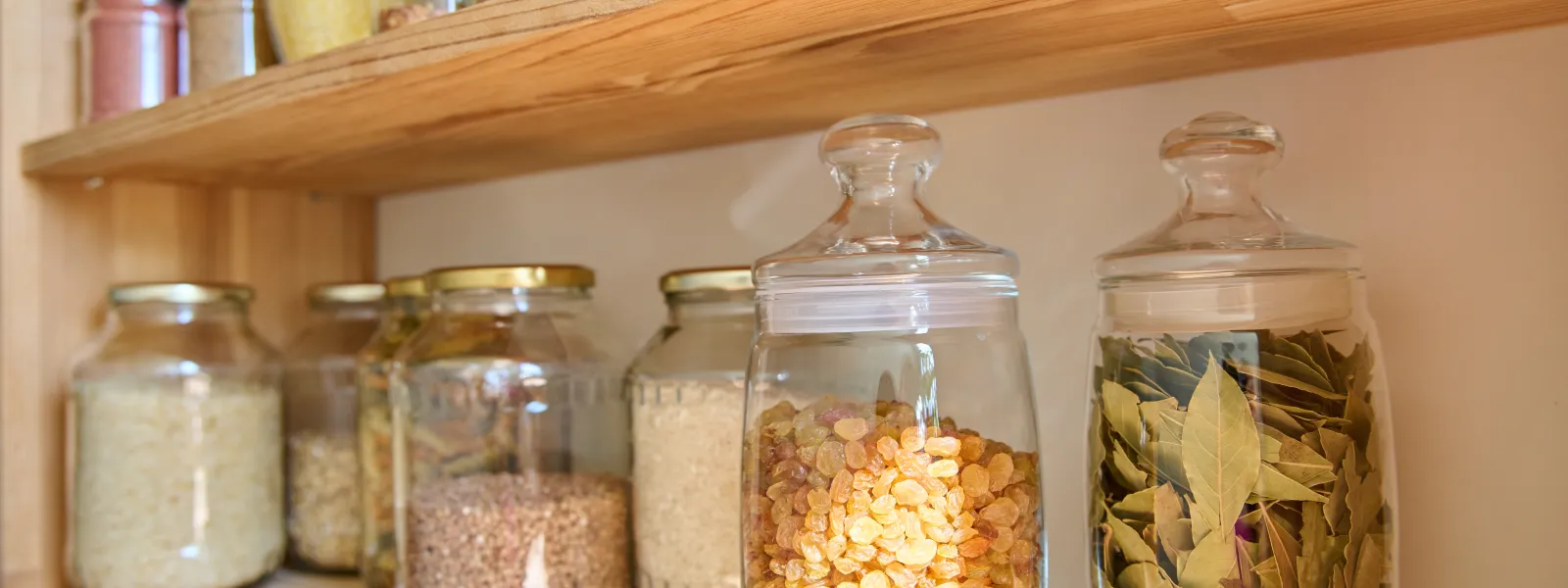 a shelf with jars of food on it