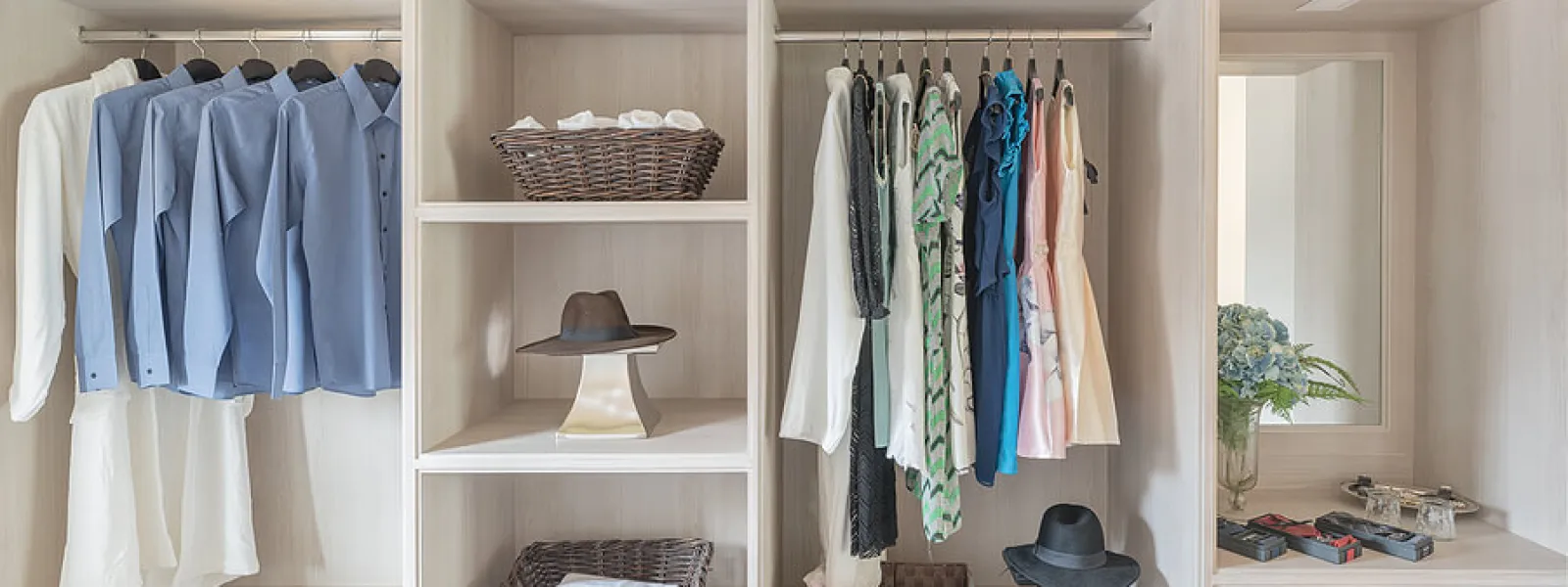 a closet with clothes and hats