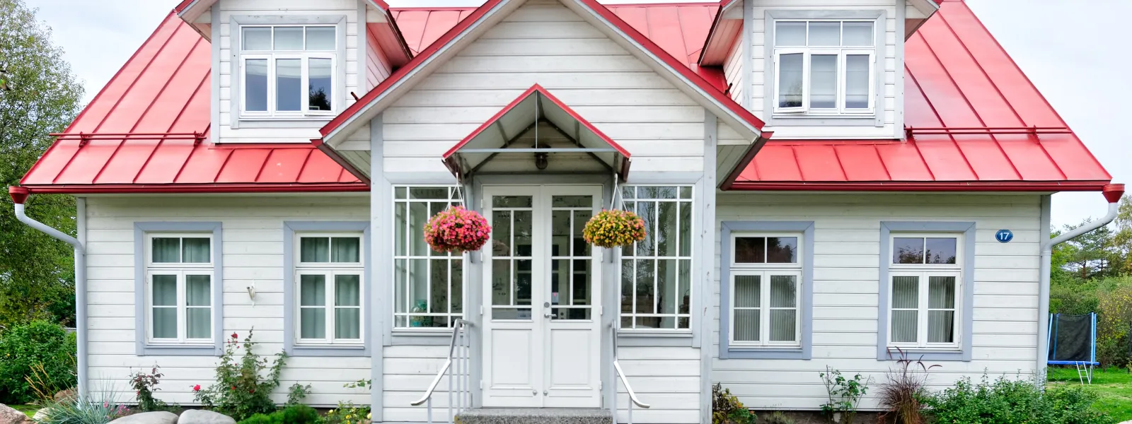 a white house with a red roof