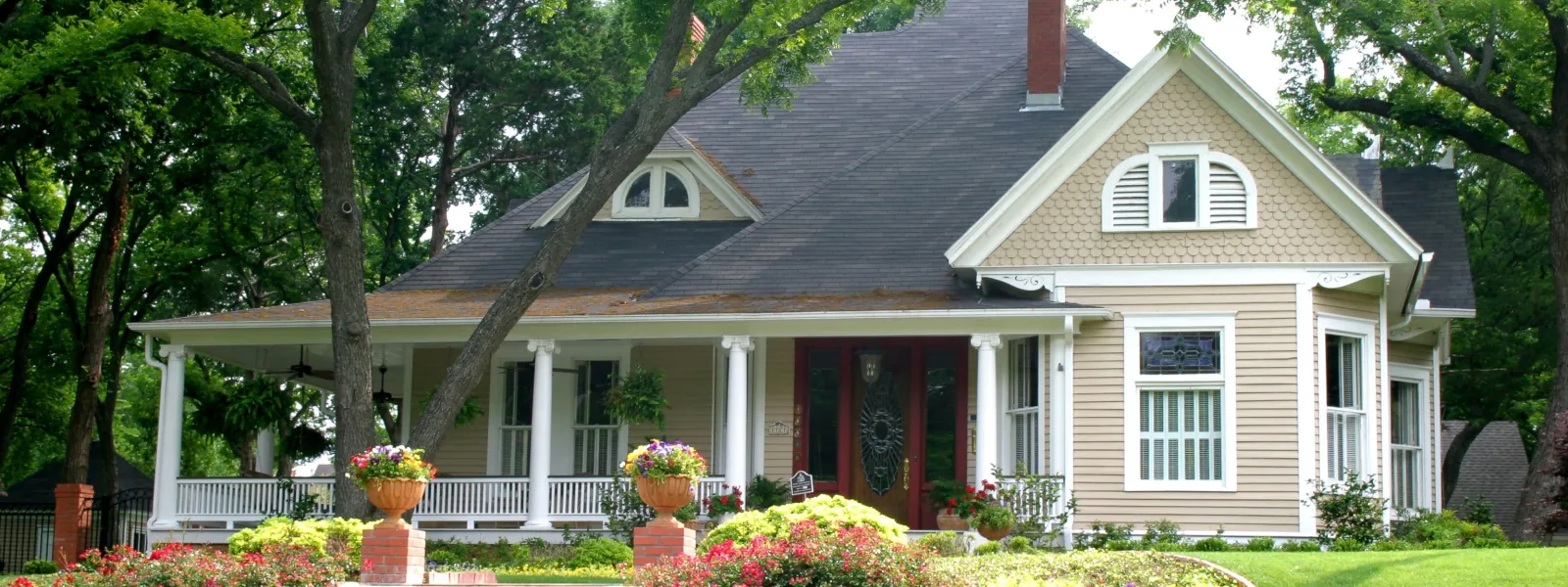 a large house with stairs leading up to it