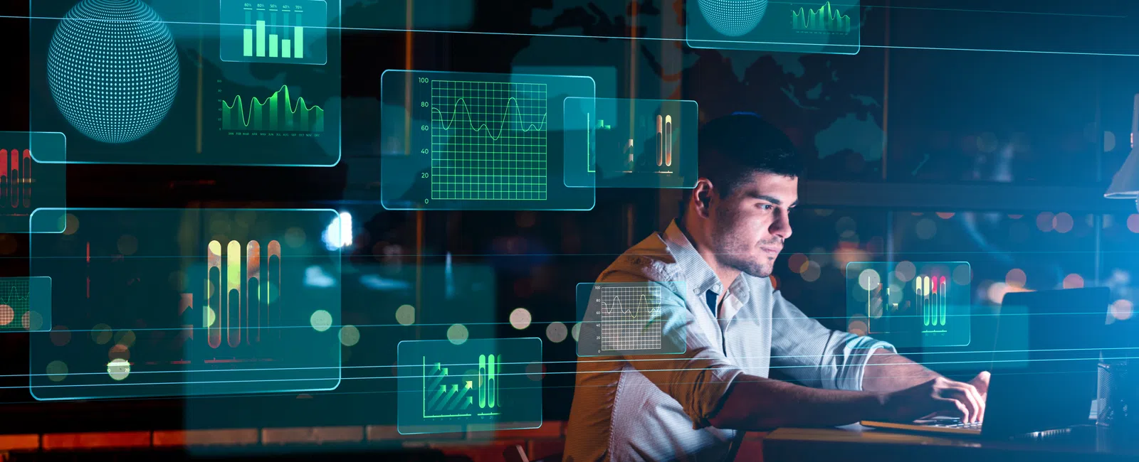 Man working on laptop at night surrounded by floating digital data charts and graphs in futuristic interface.