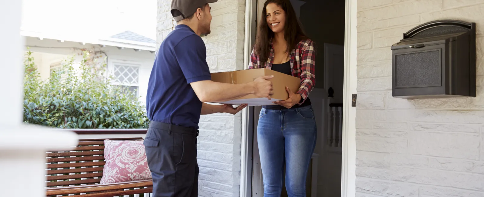 a man and a woman standing outside a house