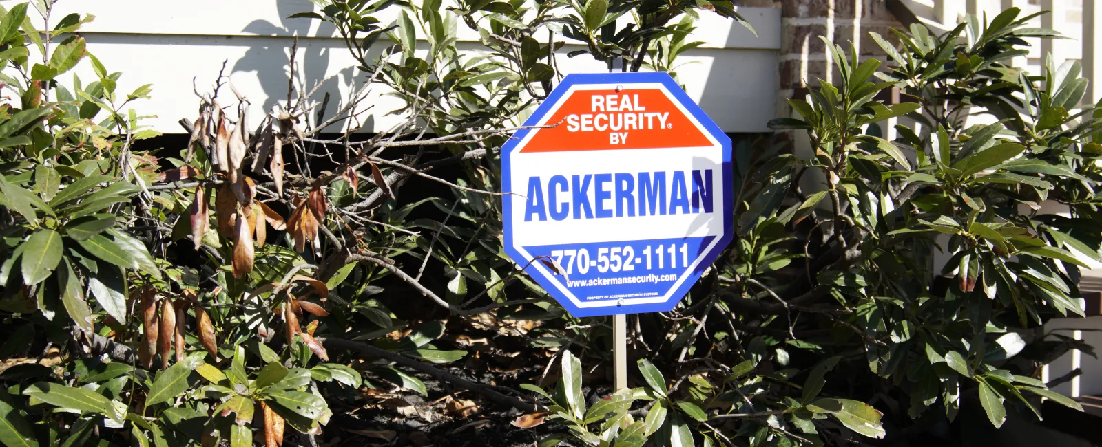 an Ackerman sign in the front of a house