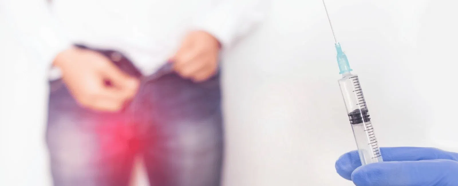Man holding crotch in pain with red highlight, doctor holding syringe for possible treatment or injection