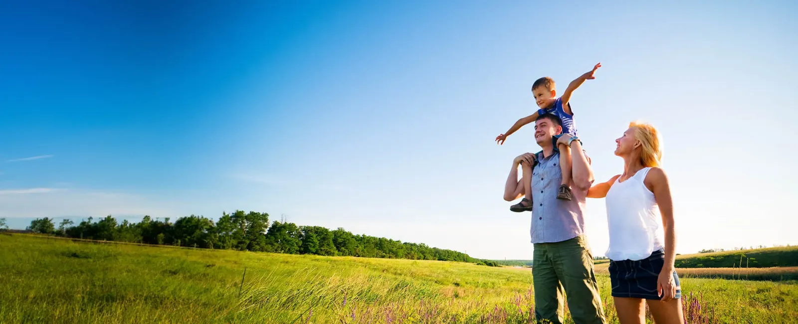 a family walking in a field