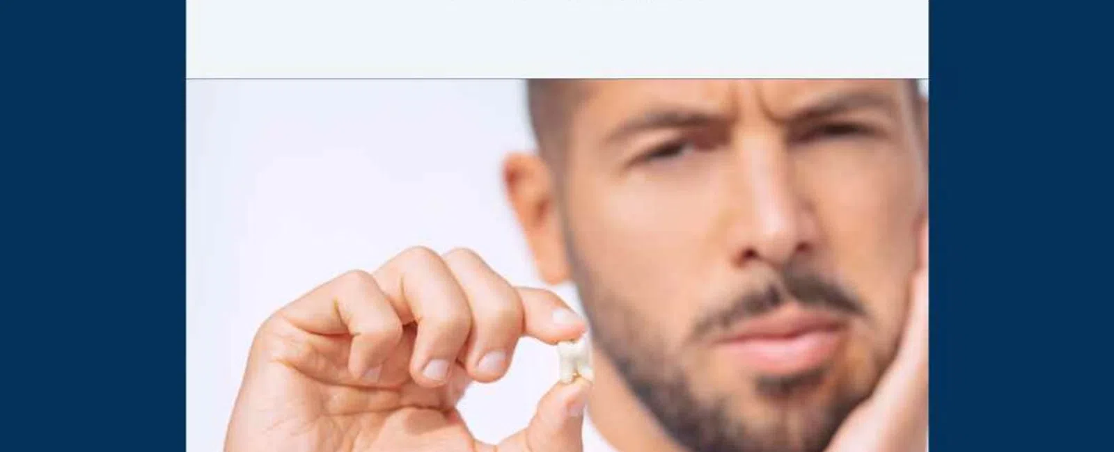 Man holding extracted wisdom tooth with a pained expression, highlighting wisdom tooth removal education.