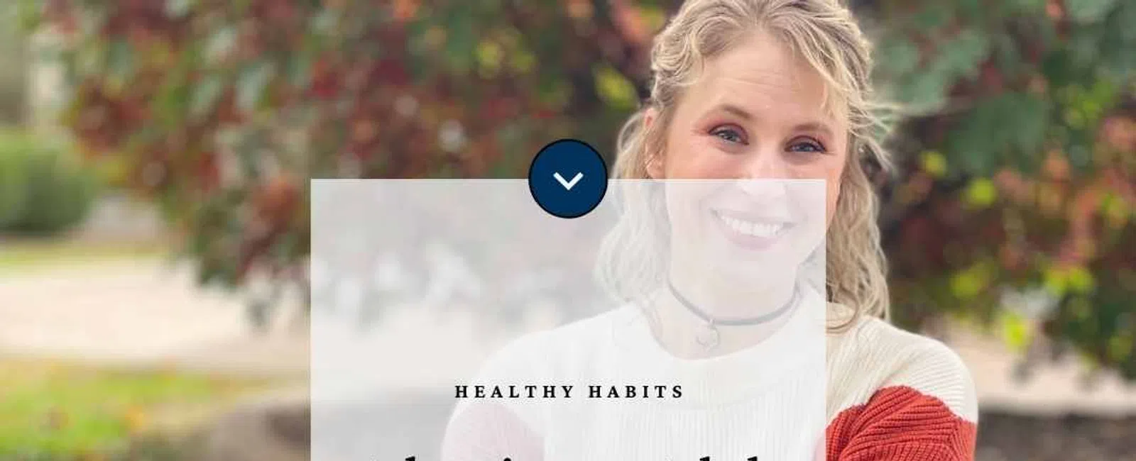 Smiling woman sitting on grass wearing casual fall clothes with a text overlay about adapting to adult life using SimplyClear.