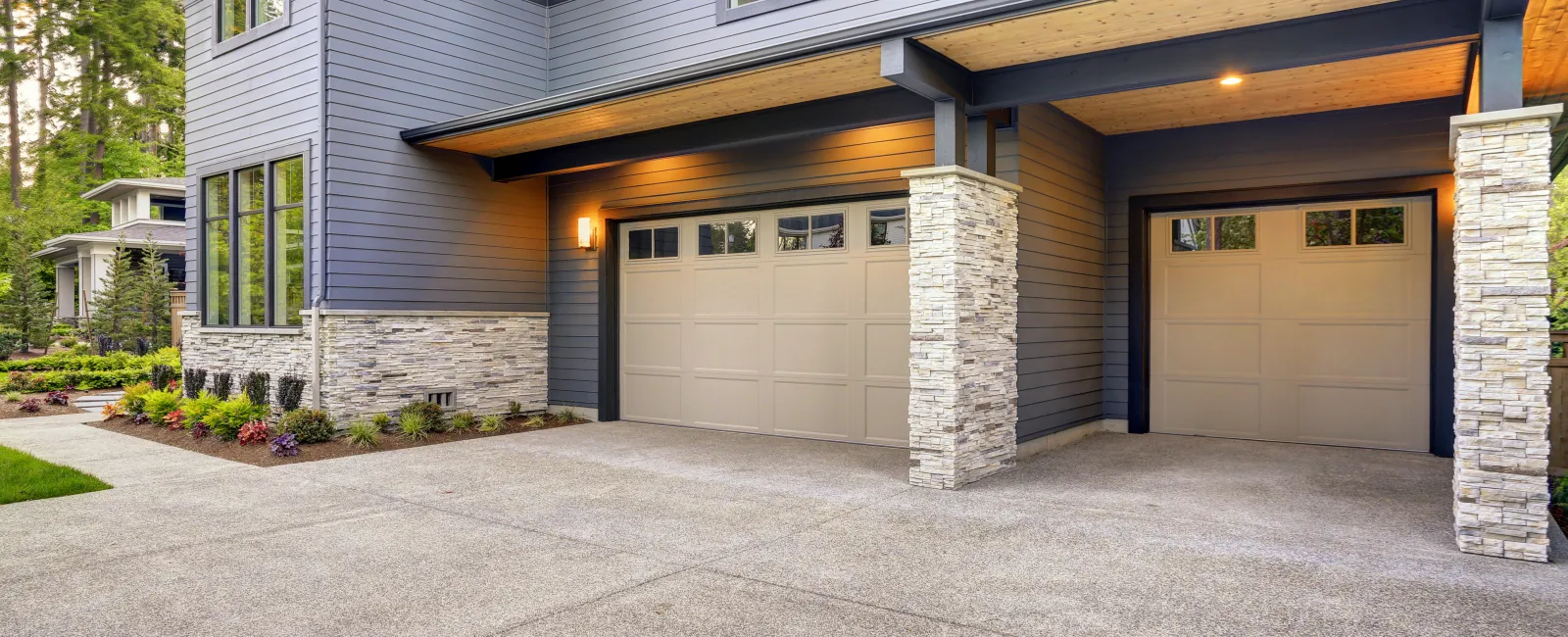 a house with garages and a driveway