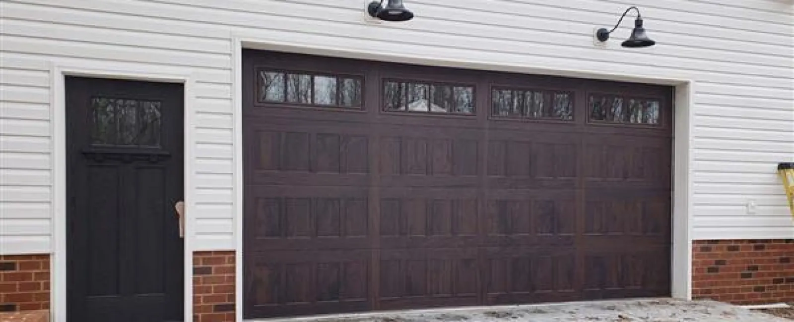 a garage door with a light above it