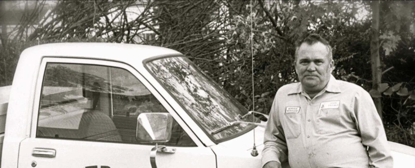 a man standing next to a car