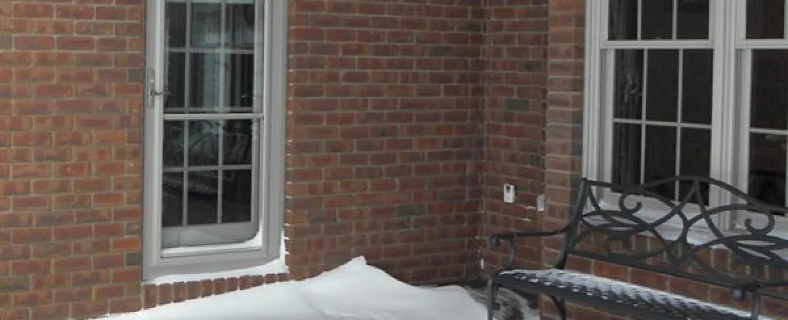 a bench in the snow