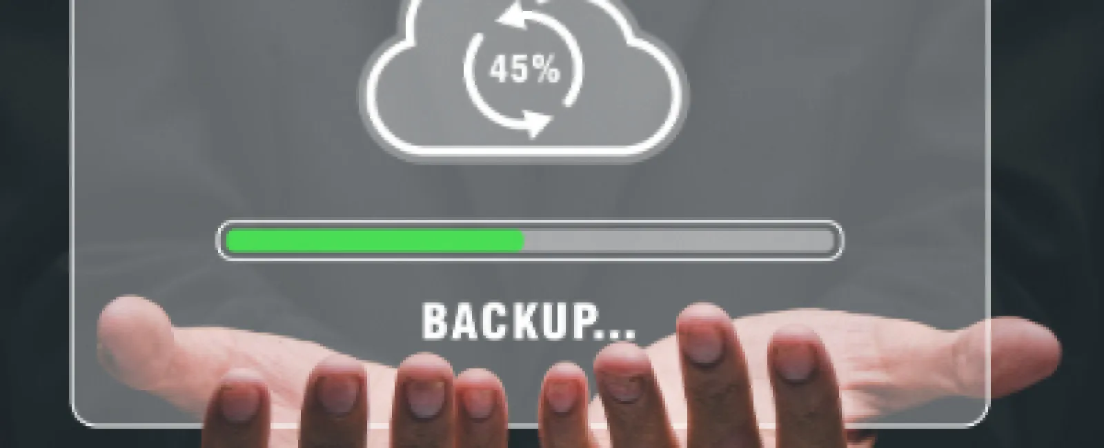 Businessman holding virtual cloud backup progress bar at 45 percent with hands open in dark suit.