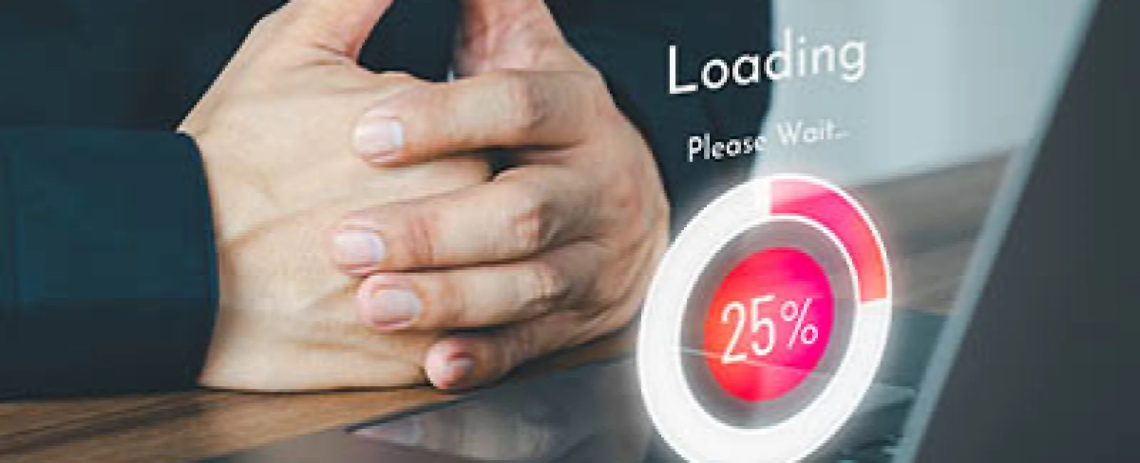 Hands folded beside laptop displaying 25% loading progress with futuristic circular graphic and text