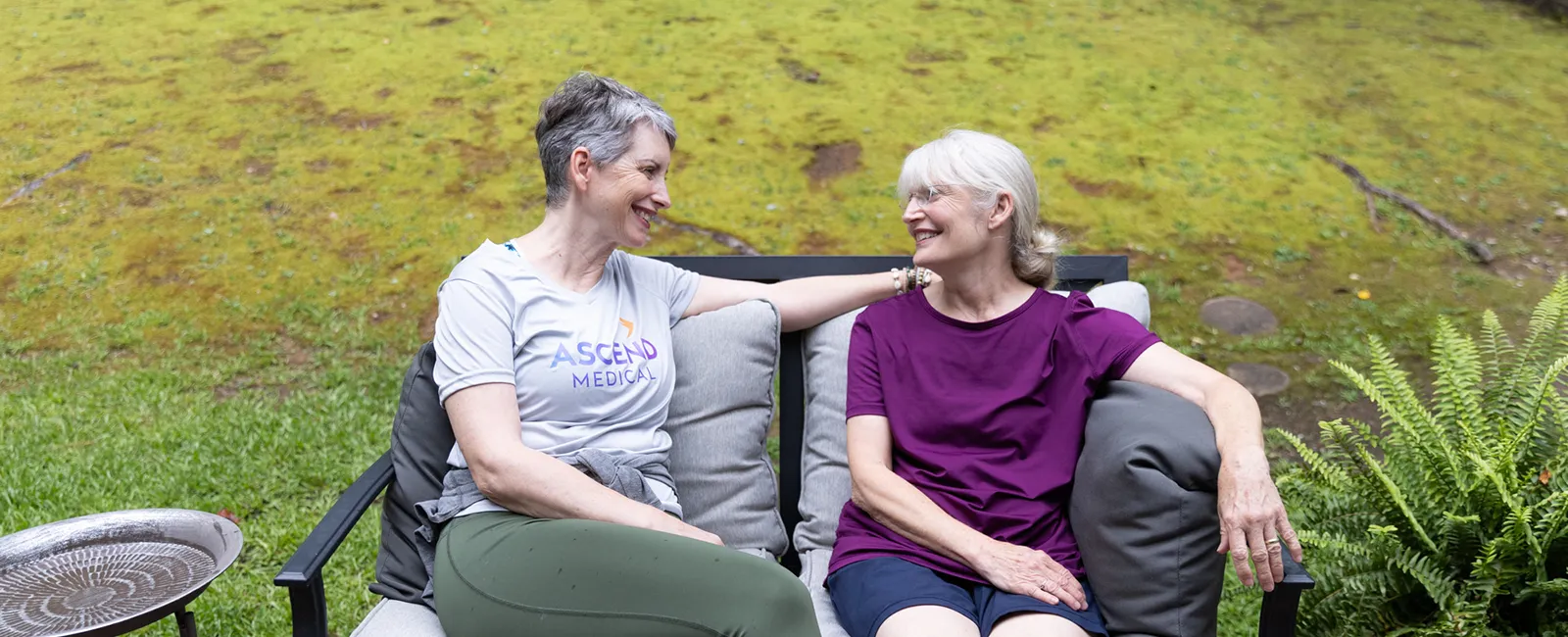 two women sitting on chairs